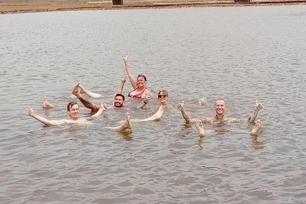 a group of people swimming in the water