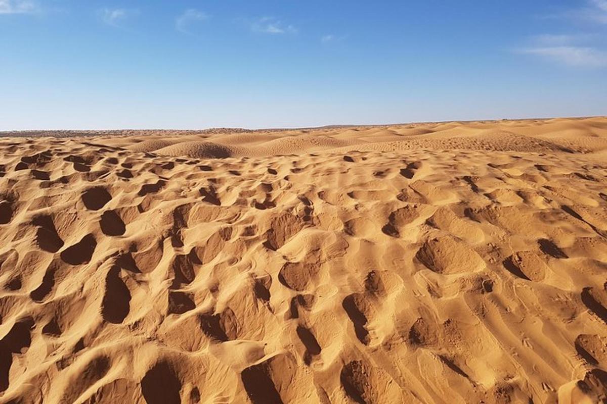 a desert with lots of ripples in the sand