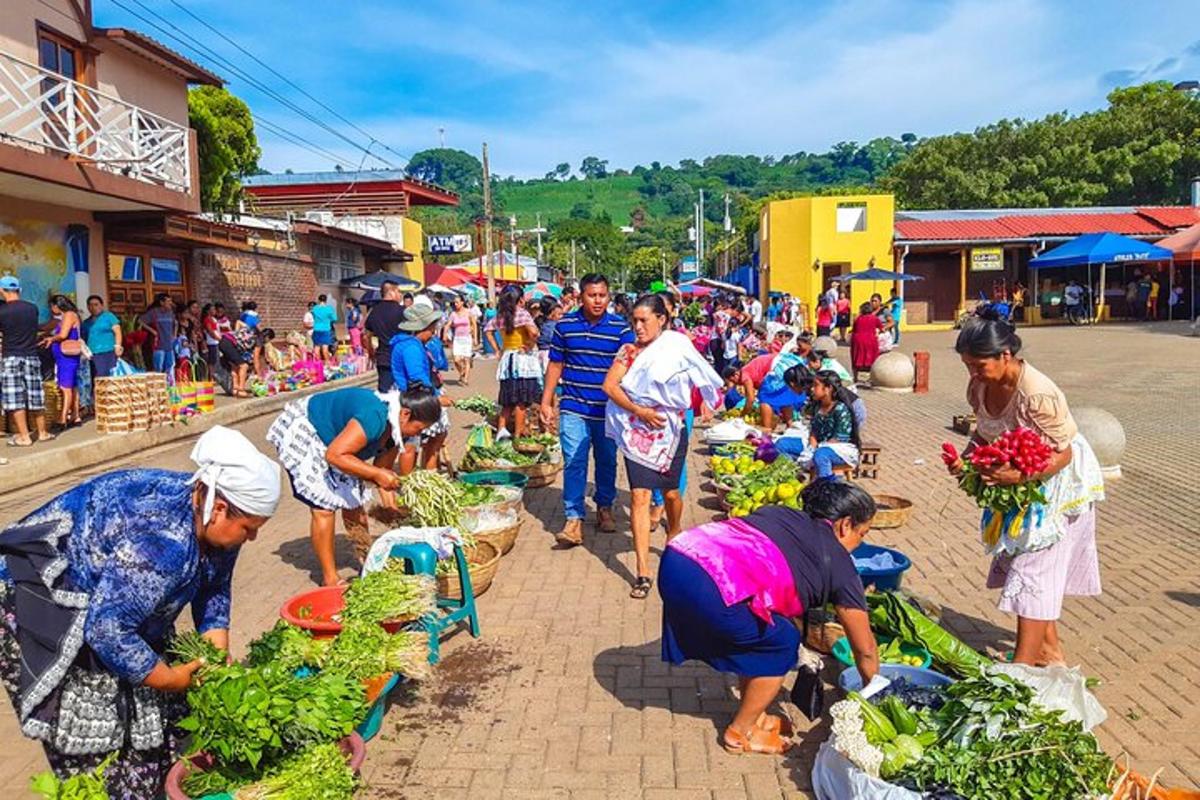 a group of people preparing vegetables at a market