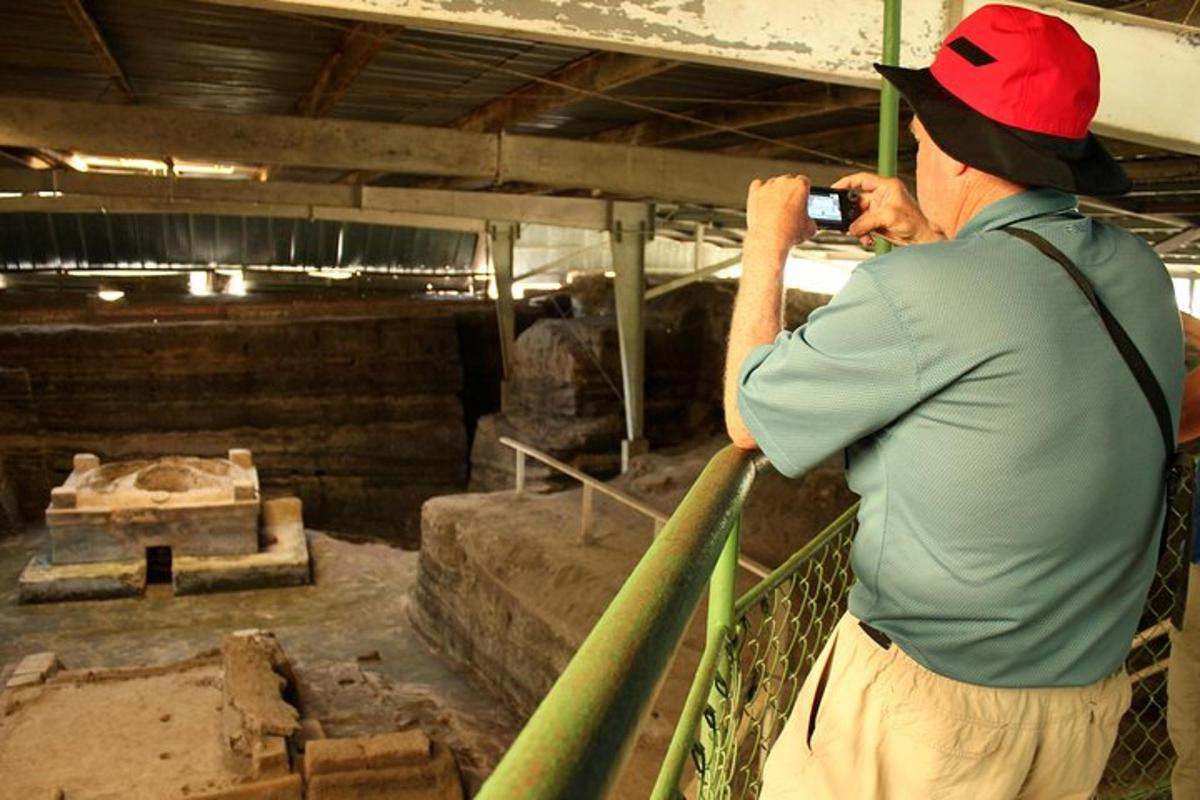 a man taking a picture of a building with a camera