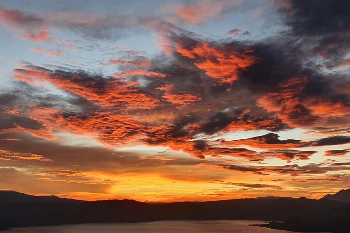 an image of a sunset with clouds