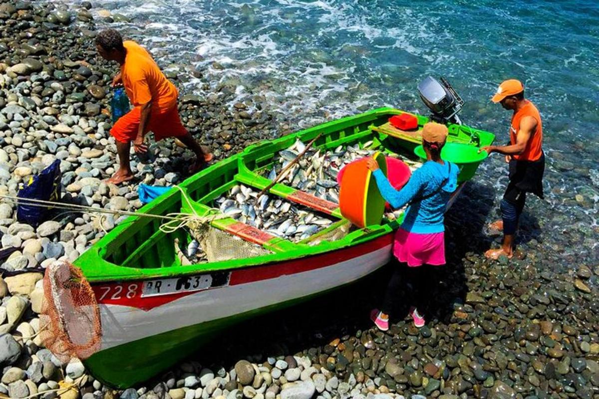 a group of people working on a boat on the shore