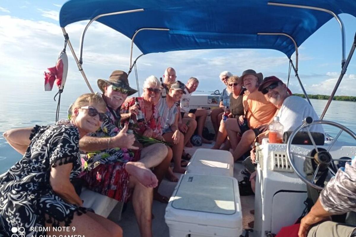 a group of people on a boat in the water