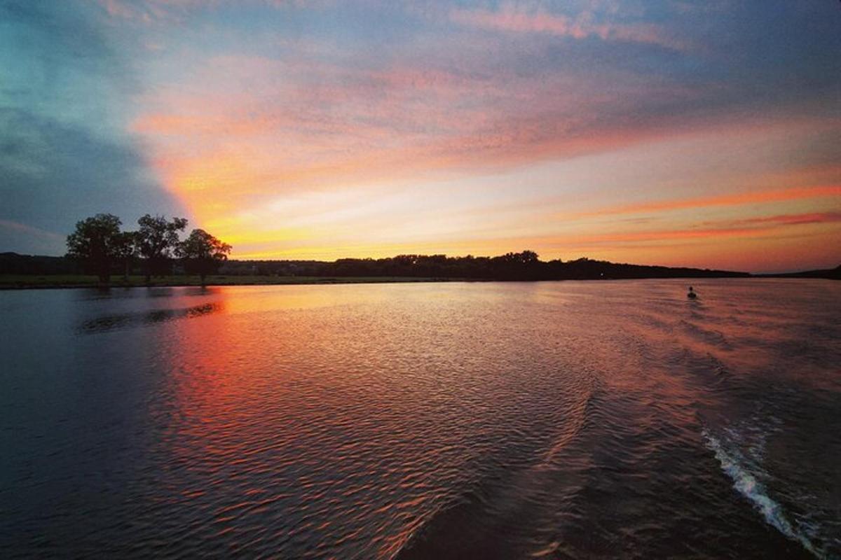 a sunset over a large body of water