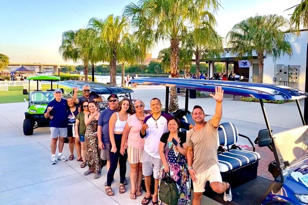 a group of people standing in front of a car