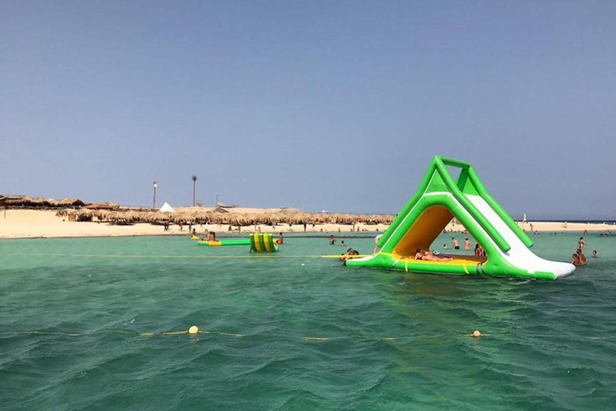 a group of slides in the water at a beach