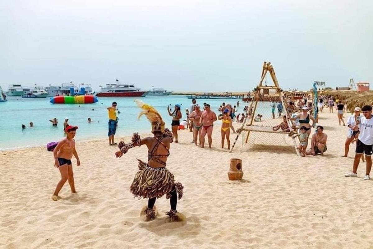 a group of people playing on a beach