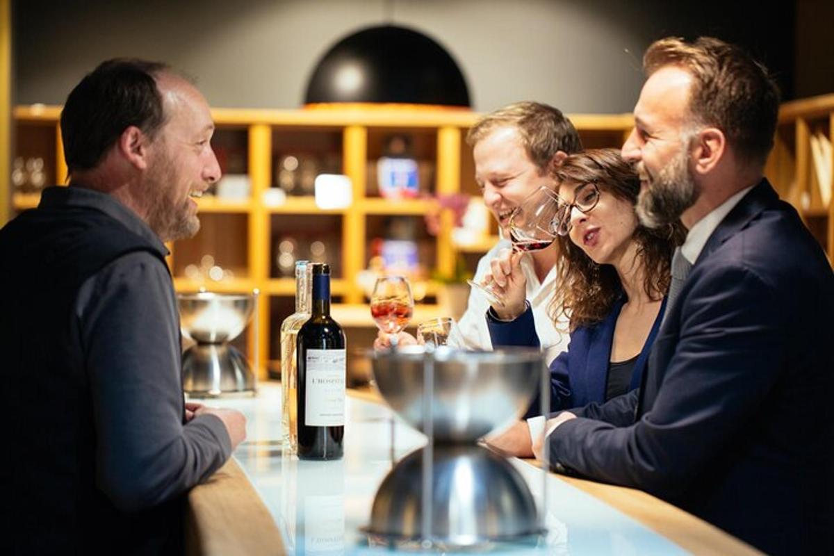 a group of people sitting at a table with wine glasses