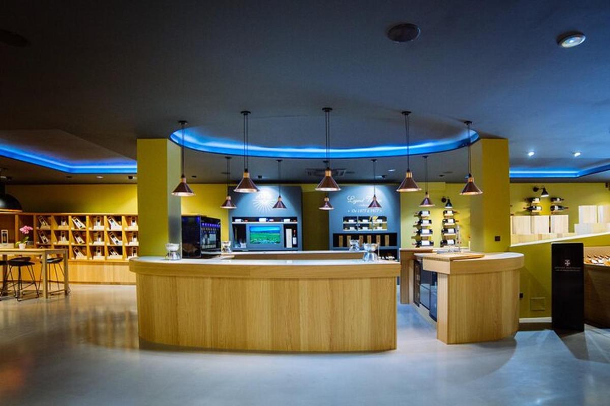 a restaurant with a bar in the middle of a room