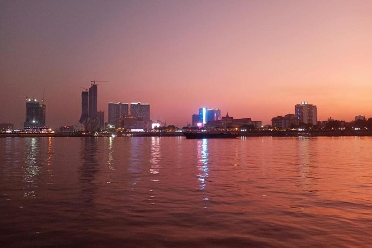 a view of a city from the water at night