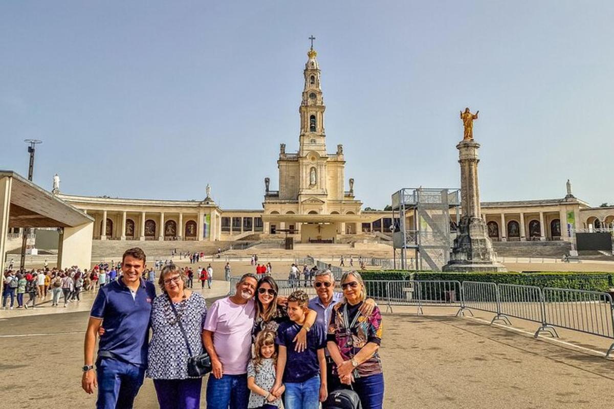 a group of people posing in front of a building