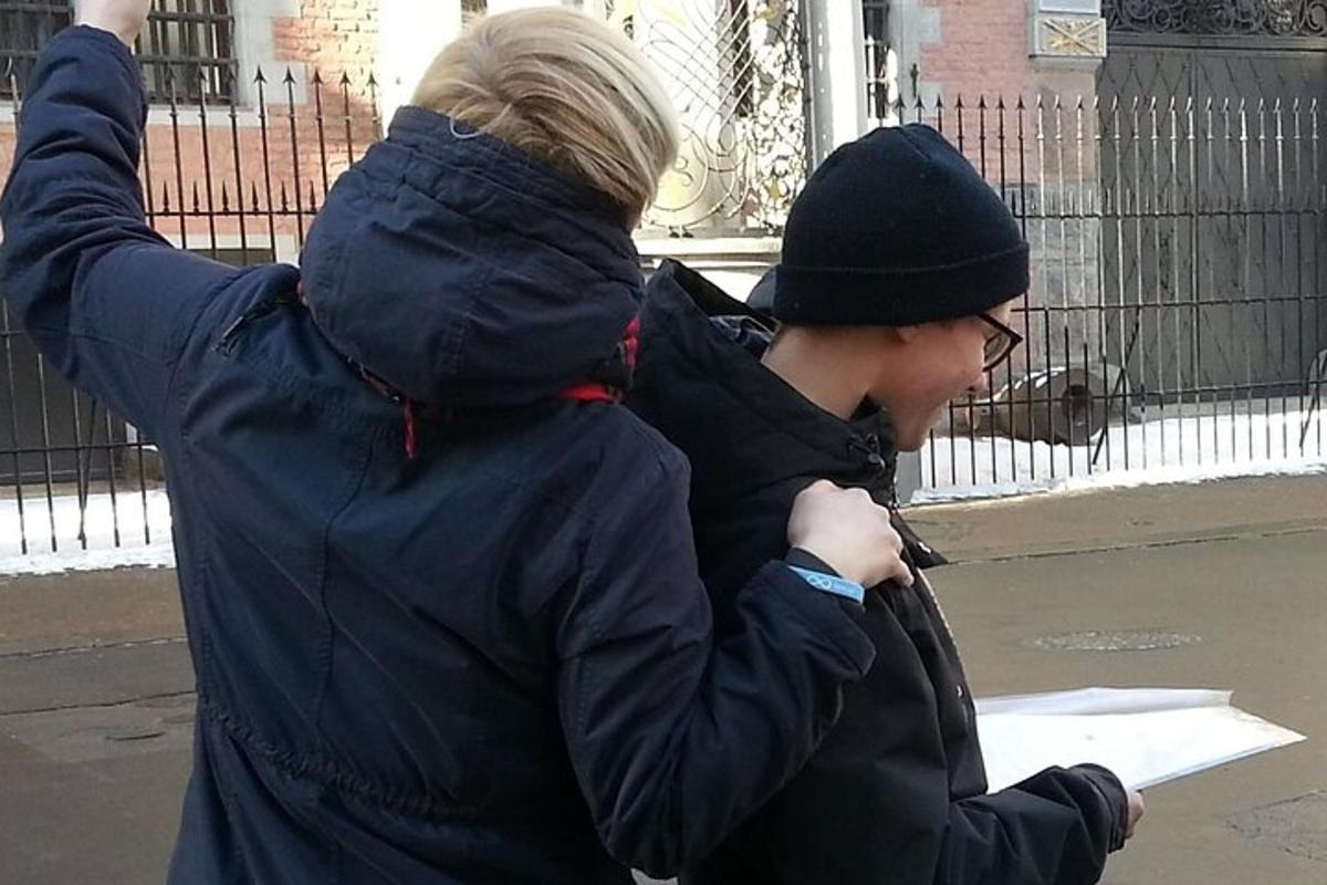 a man and a woman looking at a piece of paper