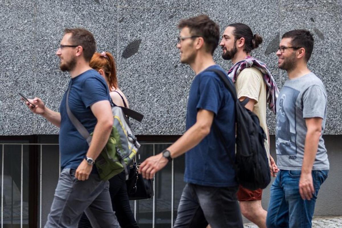 a group of men walking down the street