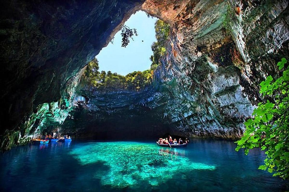 a group of people in boats in a cave