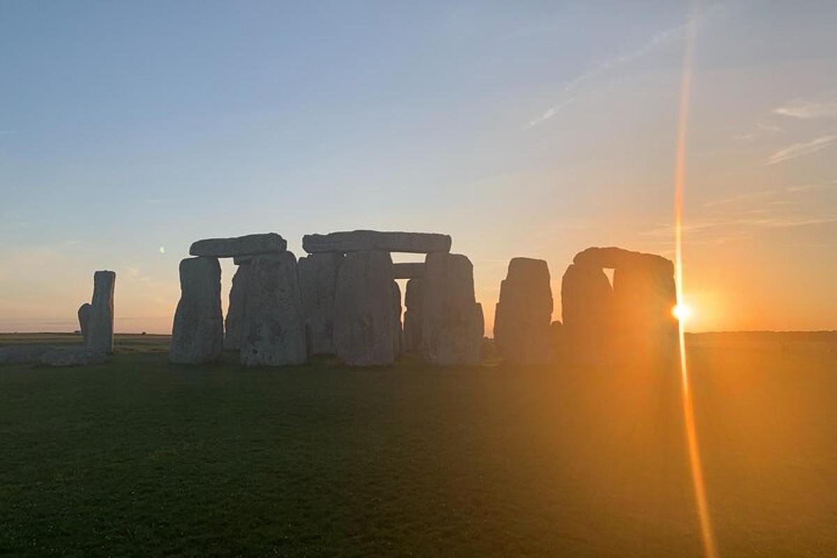 an image of stonehenge at sunset