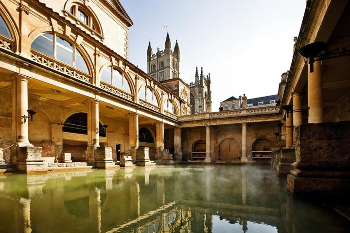 a building with a pool of water in a courtyard