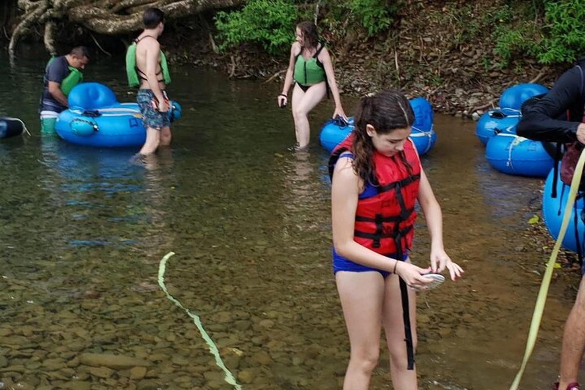 a group of people in the water with rafts