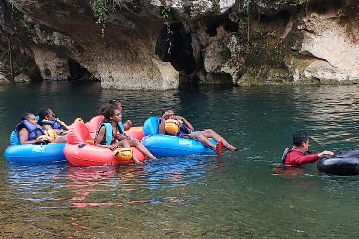 a group of people riding on tubes in the water