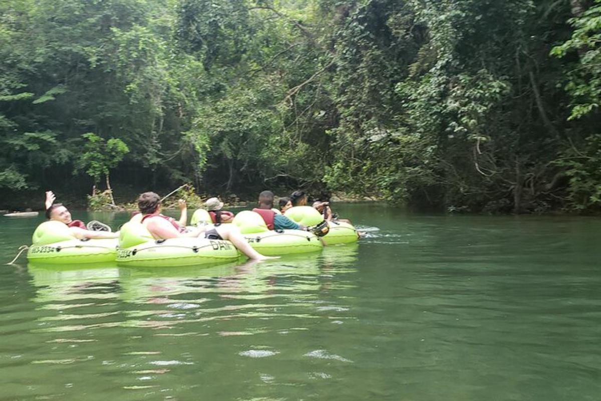 a group of people riding on tubes in the water