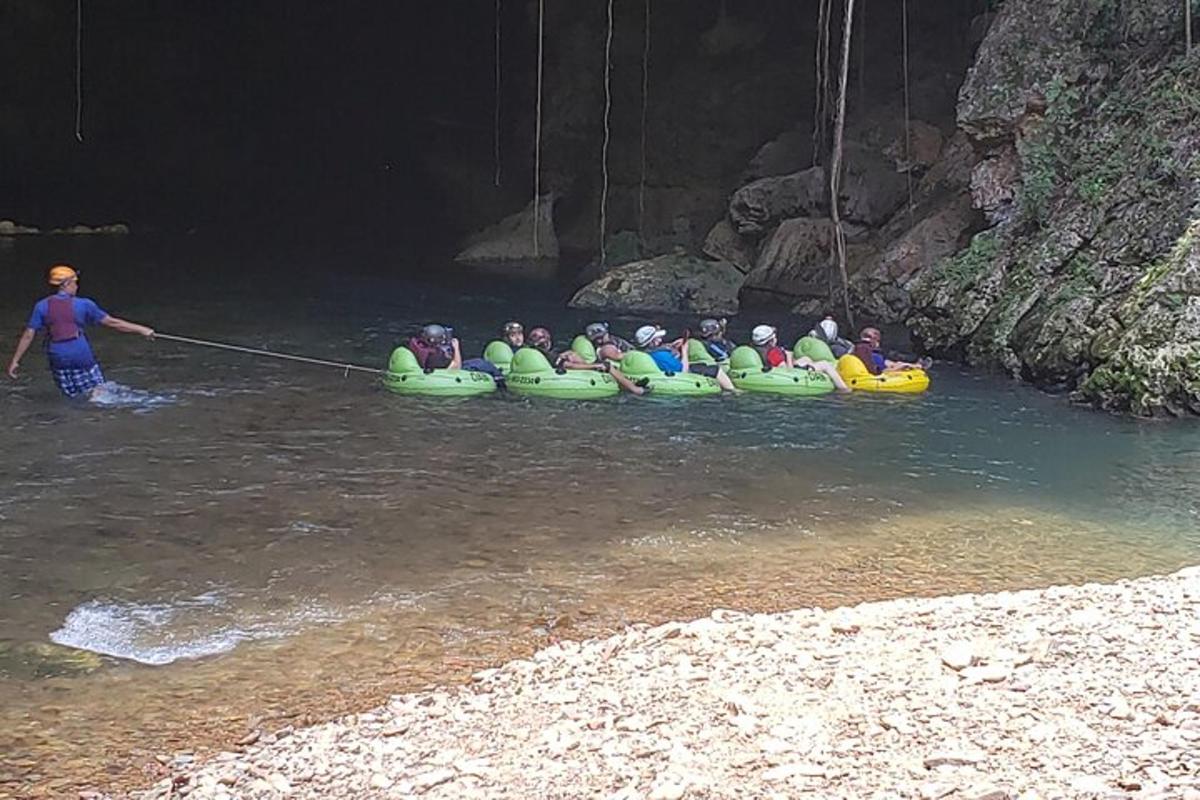 a group of people in rafts in a river