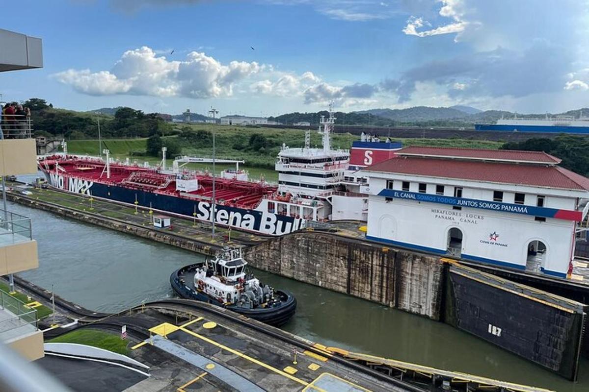 a boat is docked in a lock in a river