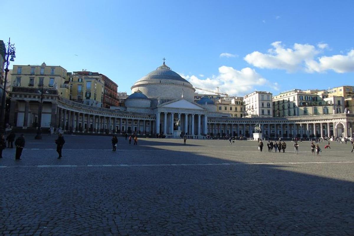 a large building with people walking in front of it