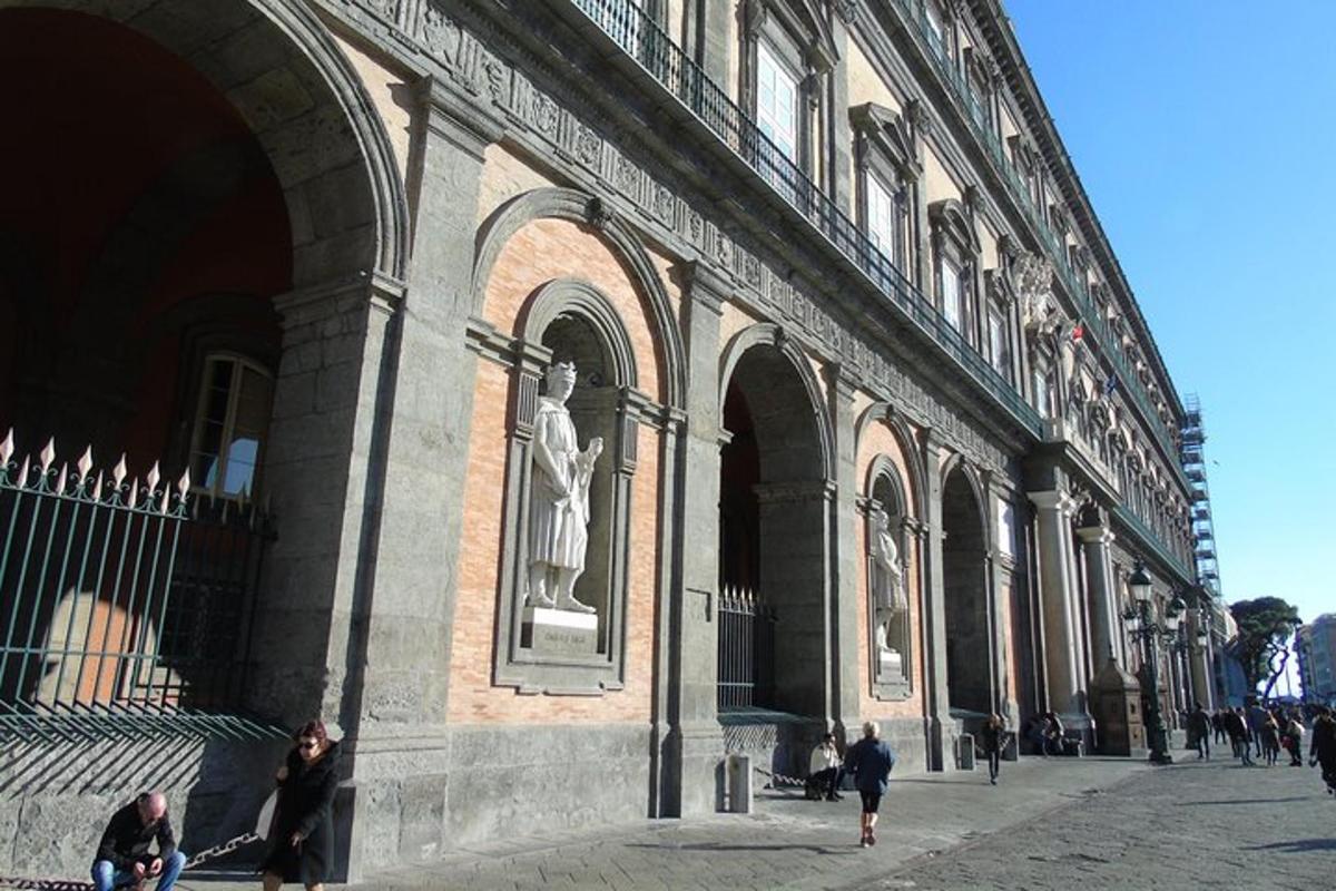 a large building with people walking in front of it