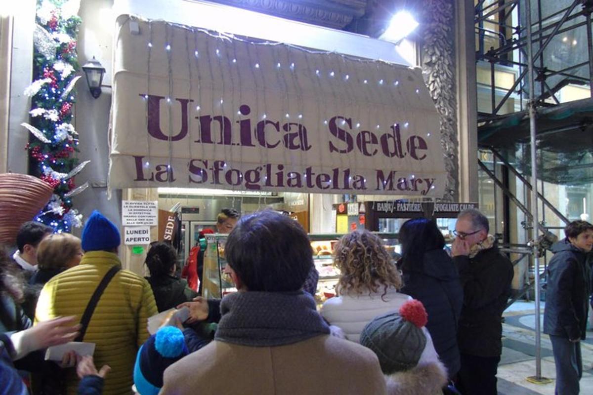 a group of people standing outside of a store