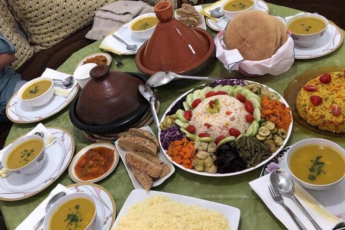 a table full of food and a pot of soup