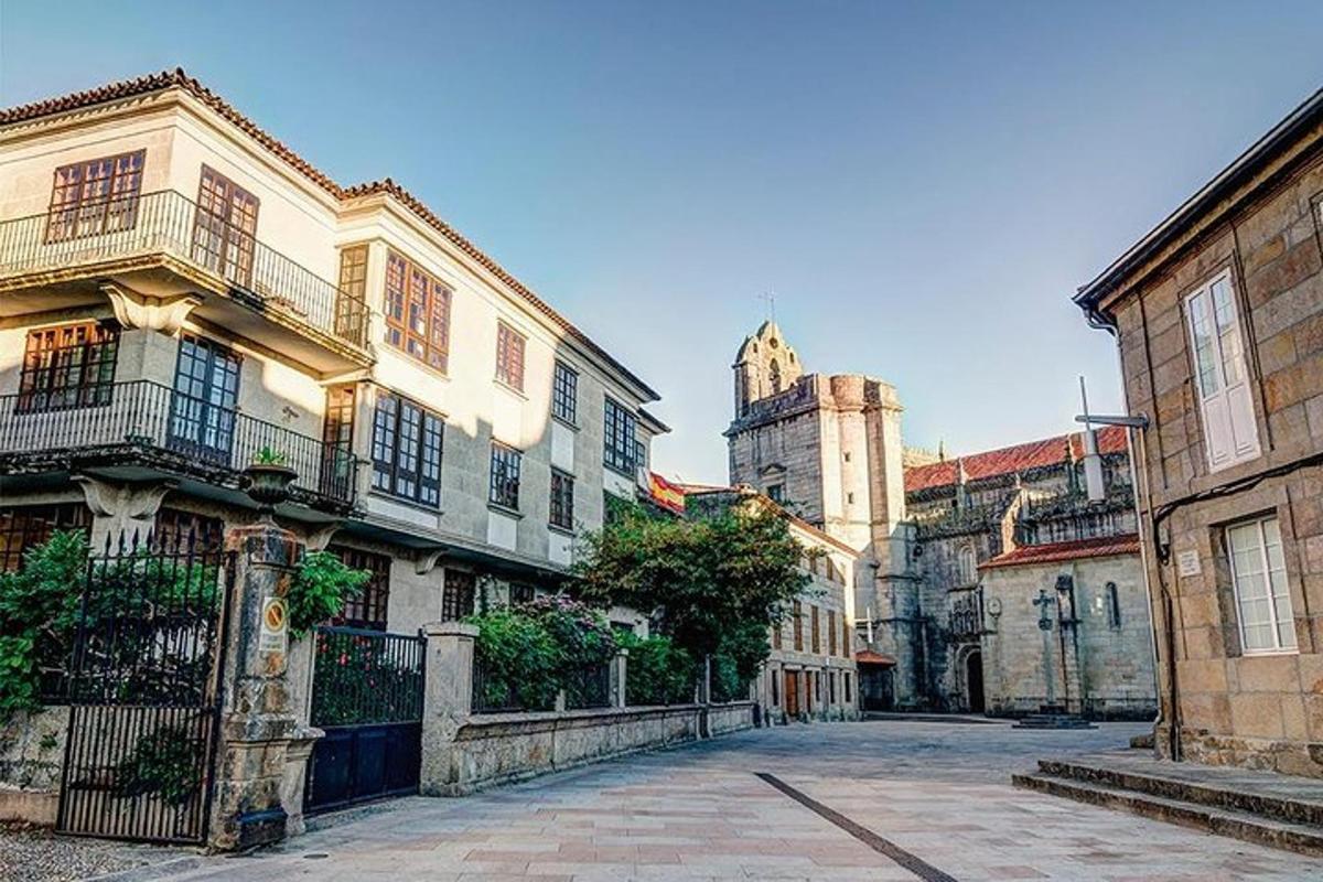 a city street with buildings and a church