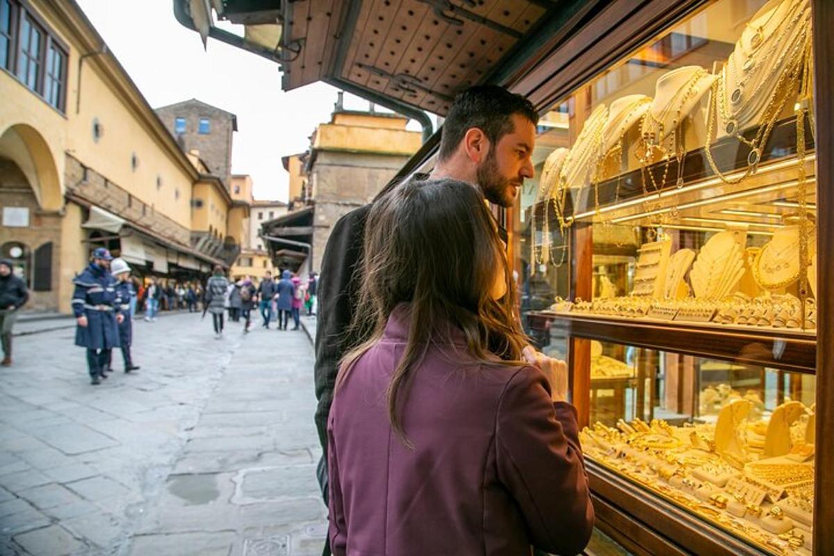 a man and a woman looking in a store window