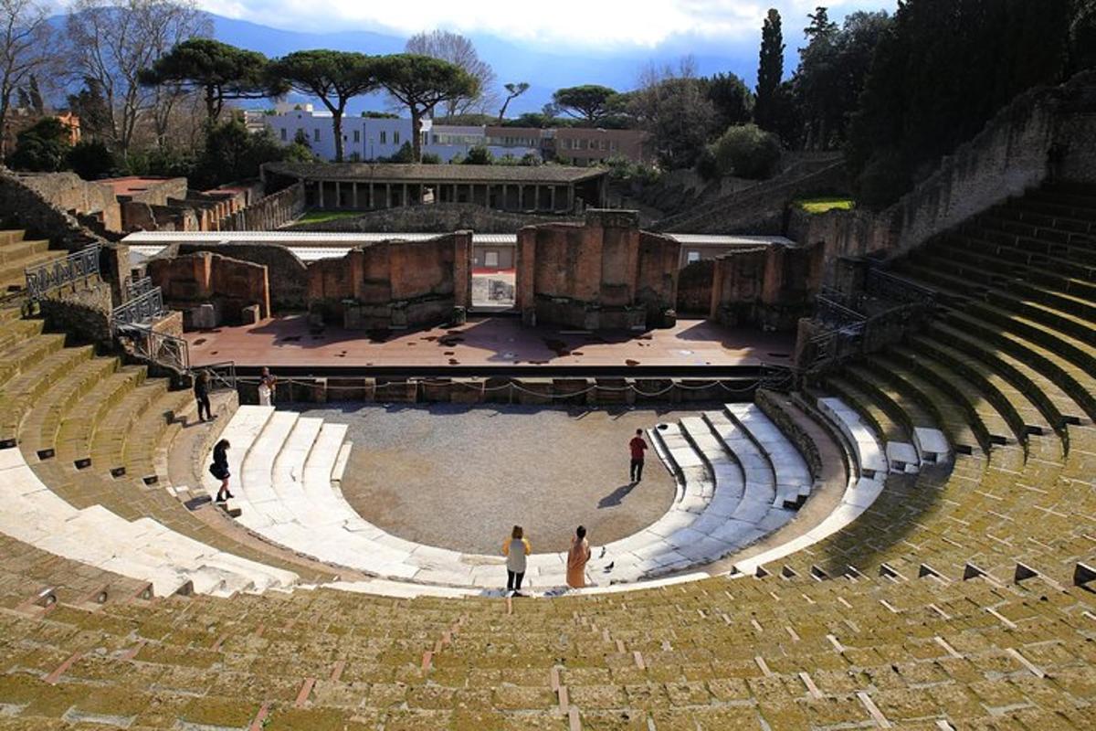 an empty amphitheater with two people standing in it
