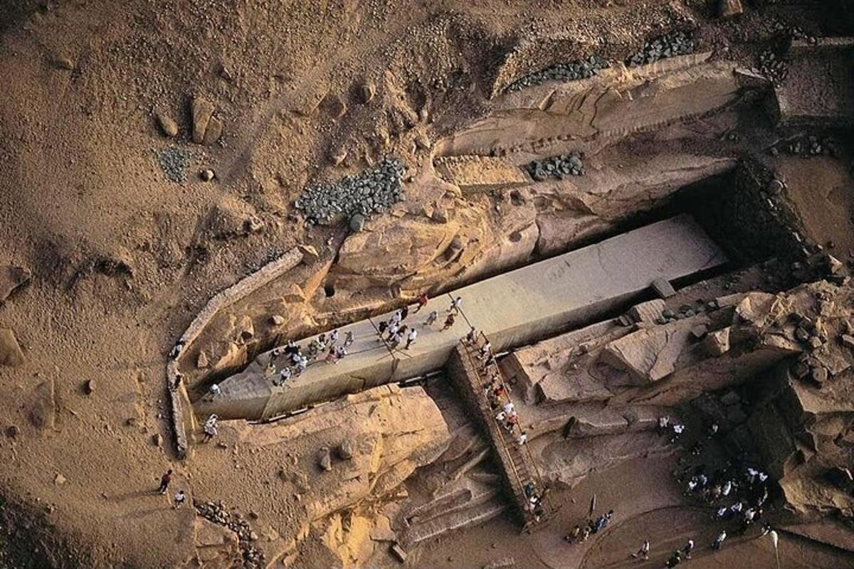 an aerial view of a building in the dirt