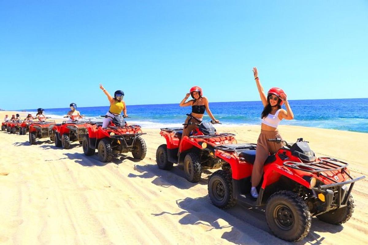 sekumpulan orang menunggang atv di pantai