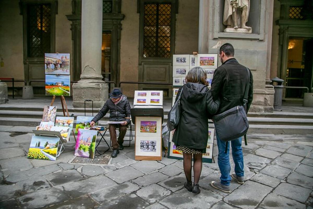 skupina lidí stojících před displejem