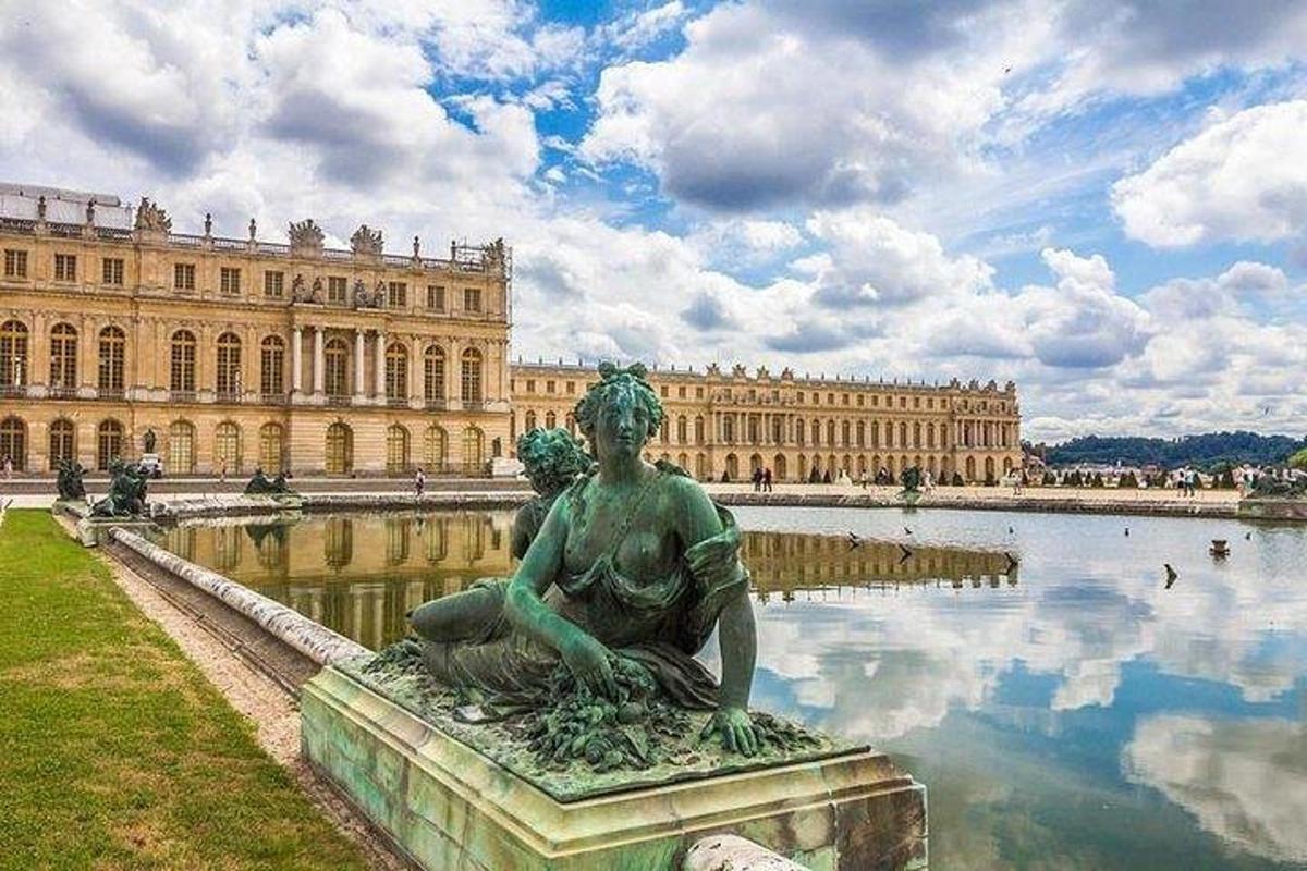 a statue in front of a large building