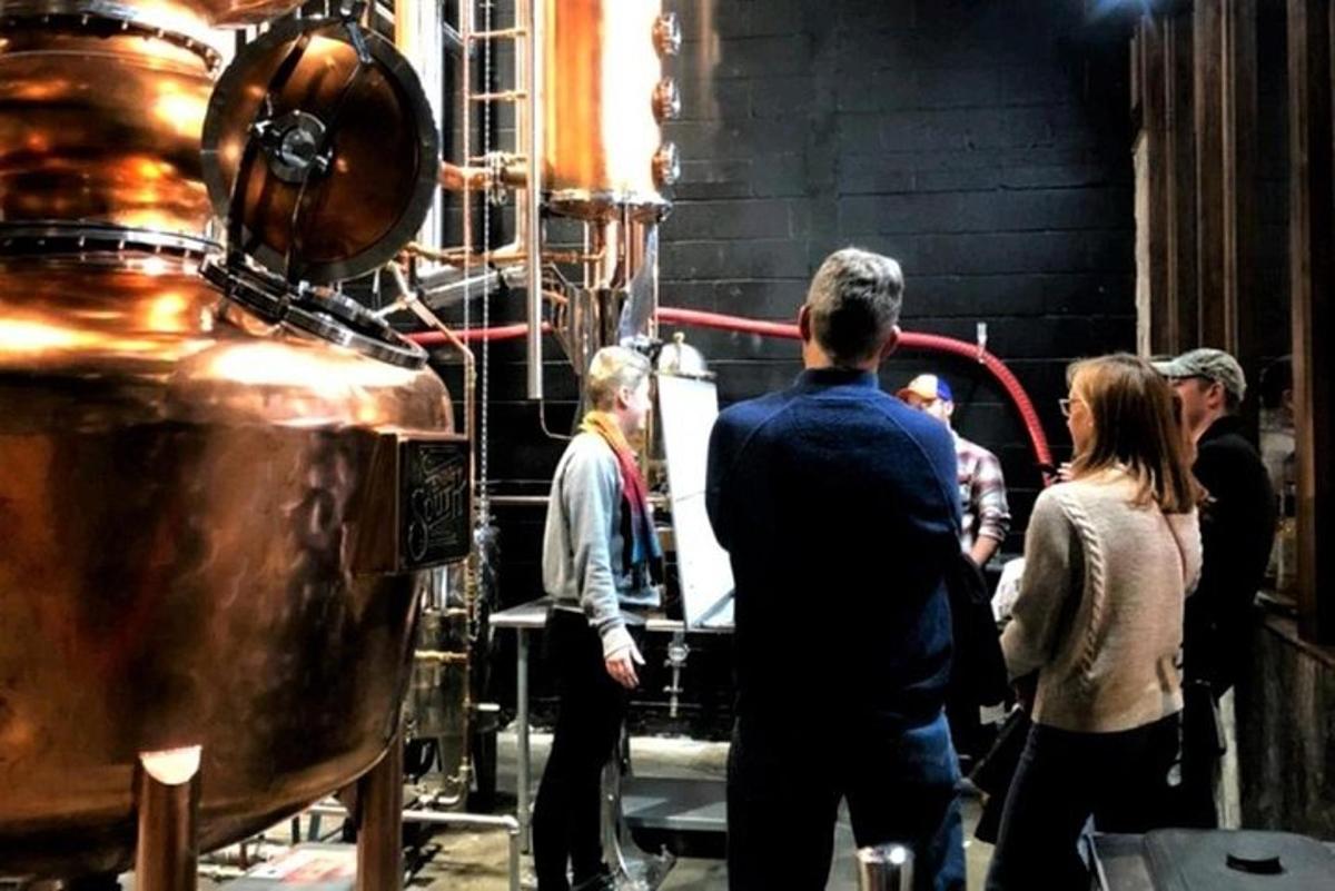 a group of people standing around in a room