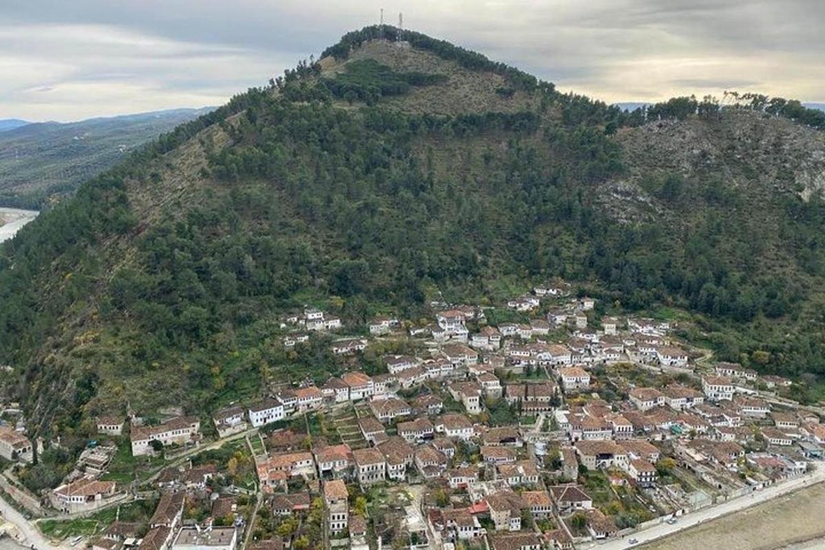 an aerial view of a town on a mountain