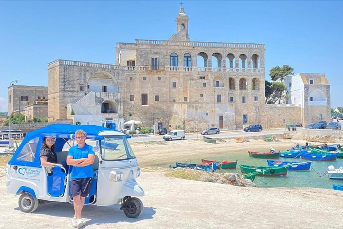 a man and woman in an ice cream cart in front of a building