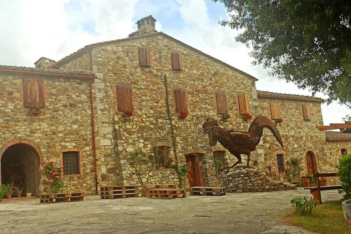 a stone building with a statue of a horse on it