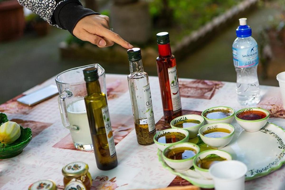 a table with bottles of wine and bowls of food