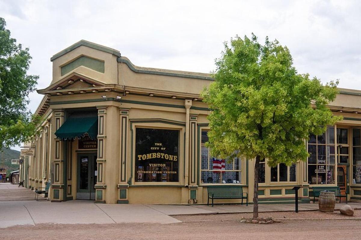 a building on a street with a tree in front of it