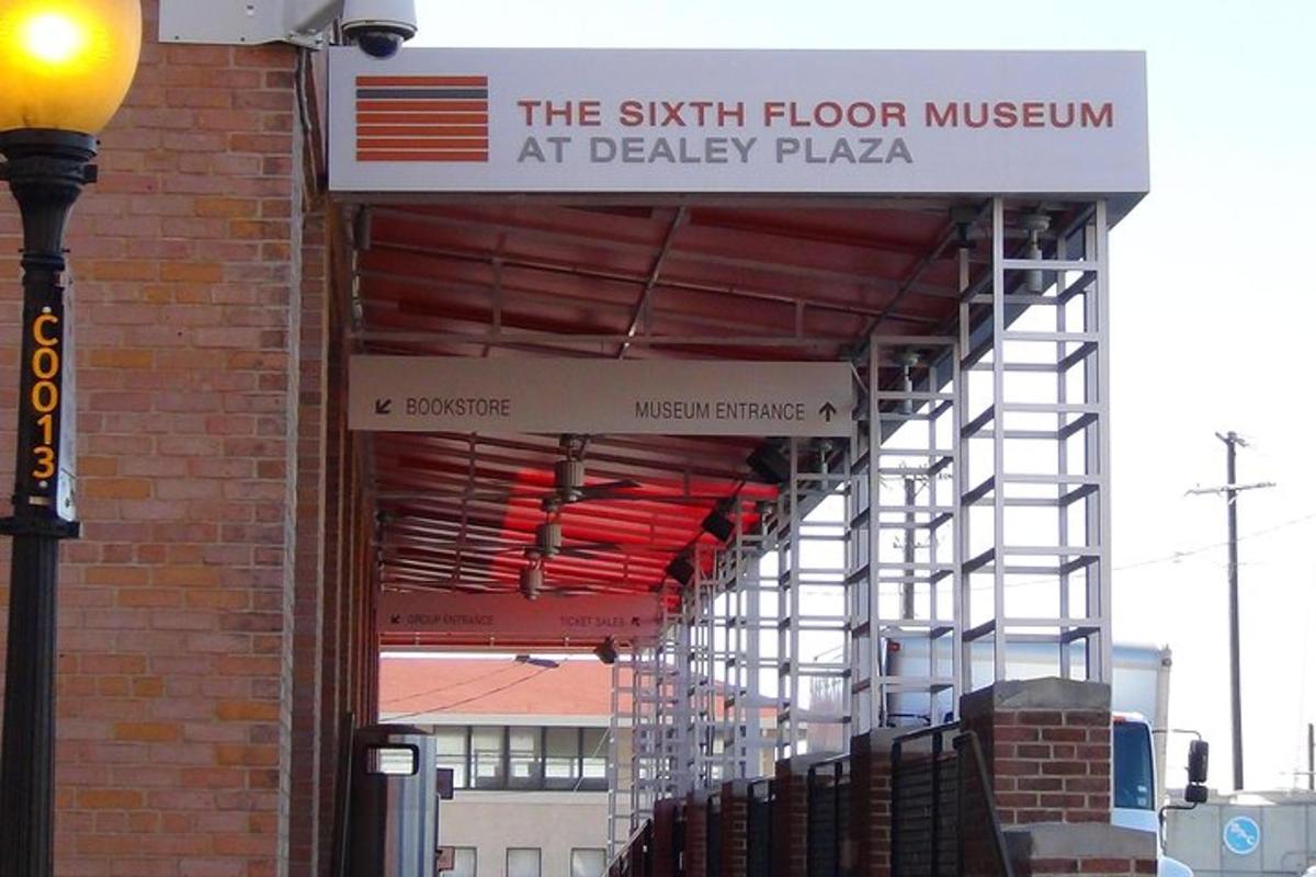 a sign for the sixth floor museum at deadly plaza