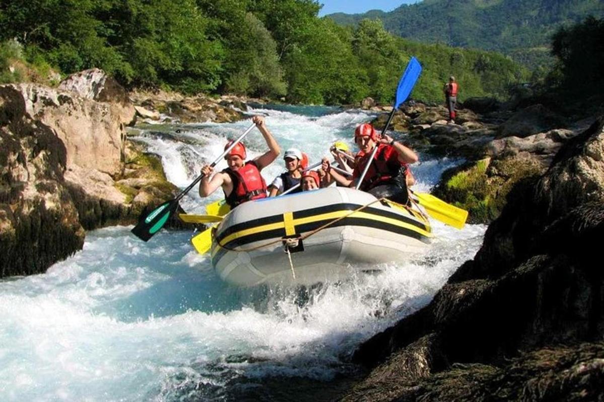 a group of people in a raft on a river