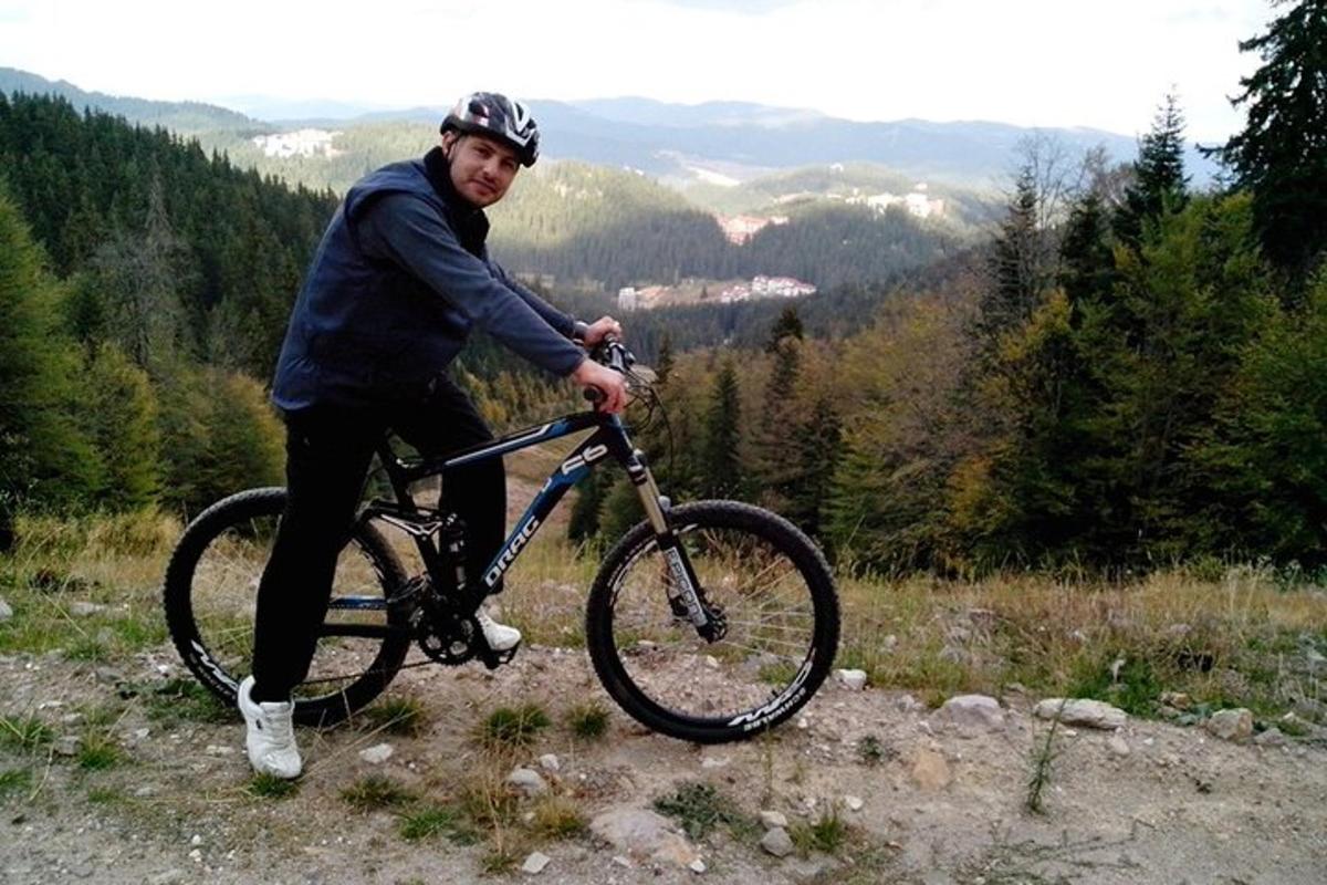 a man is riding a bike on a hill
