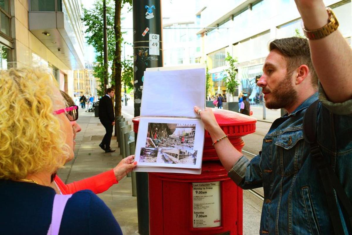 a man is putting a picture on a newspaper dispenser