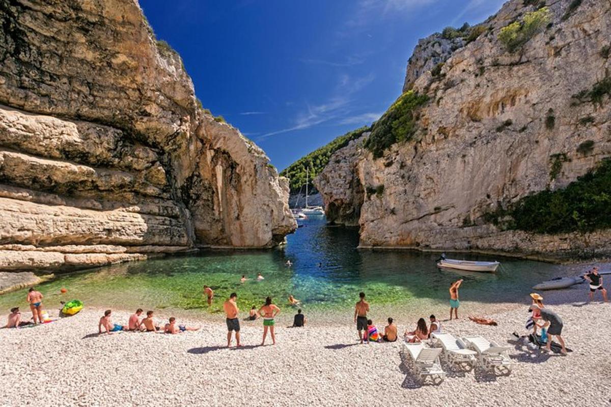 a group of people on a beach in the water