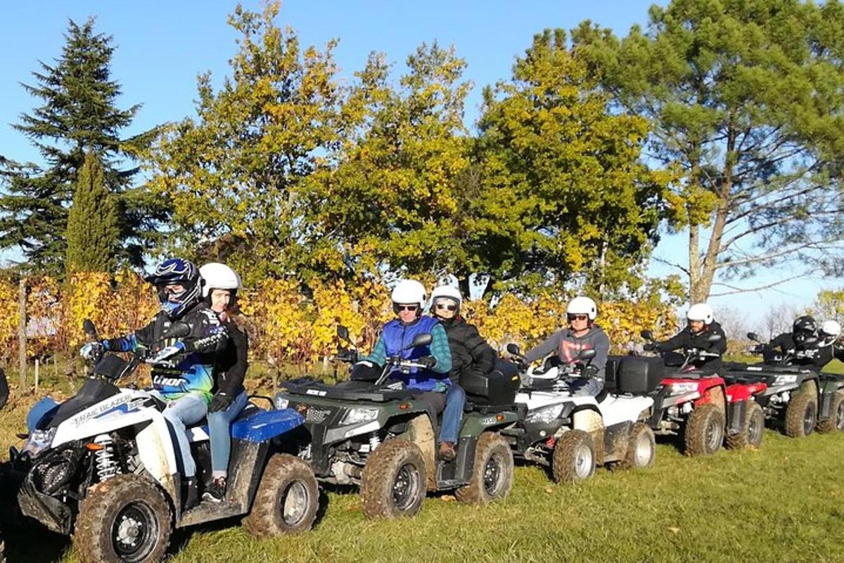 a group of people riding atvs on a field