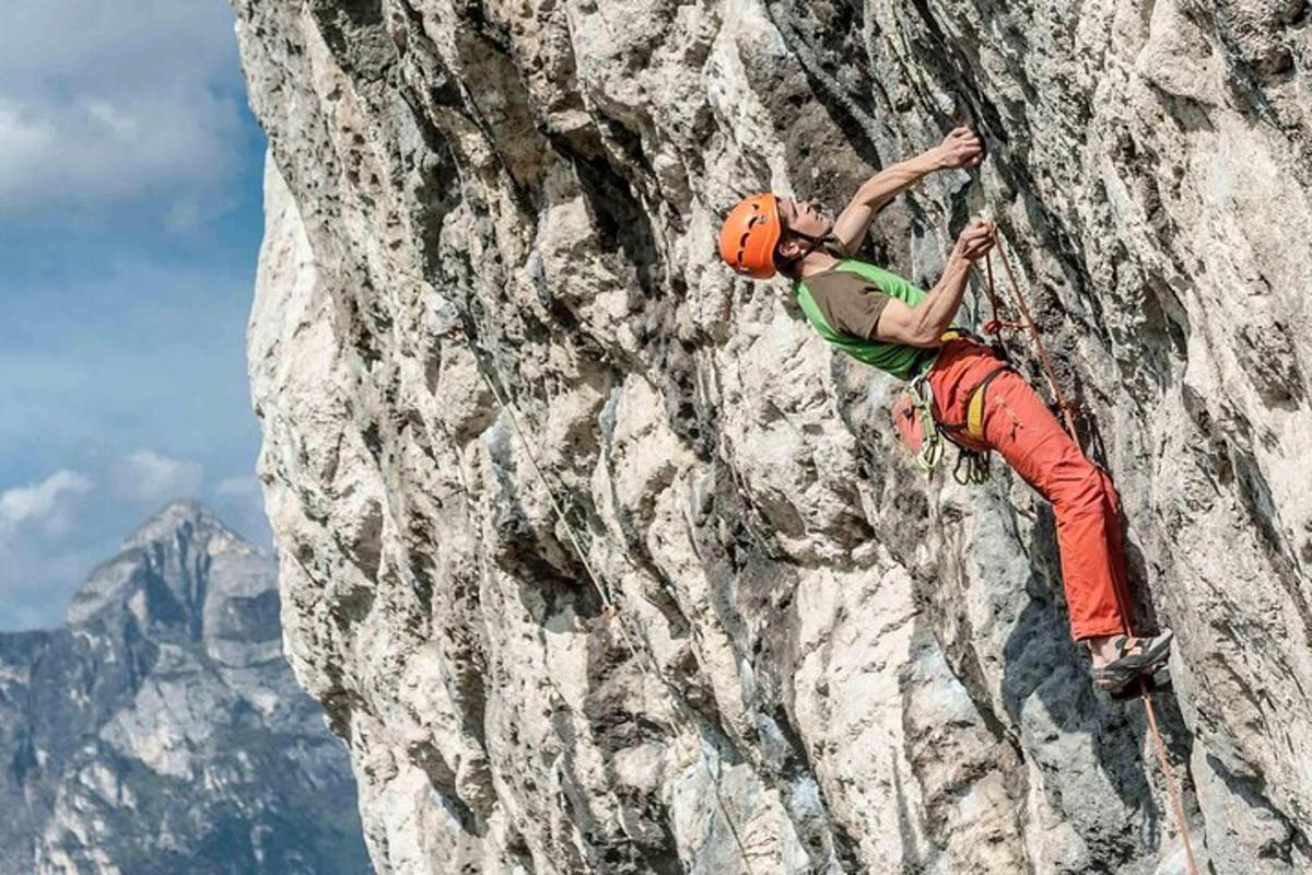 a man is climbing on a rocky mountain