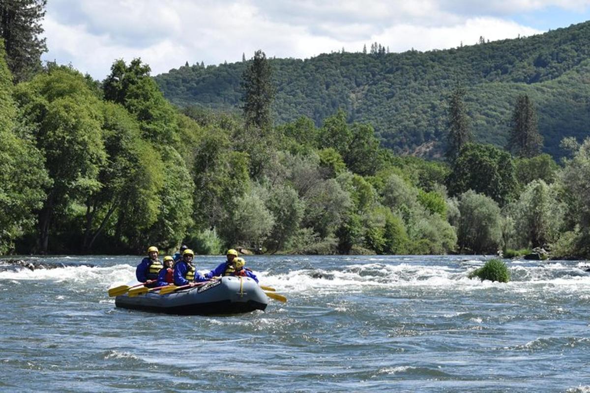 a group of people in a raft on a river